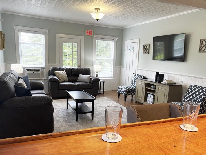 Cozy livnigroom & wet bar! Offers all the coziness guests love including modern furniture, TV, wifi, and plenty of room to relax!